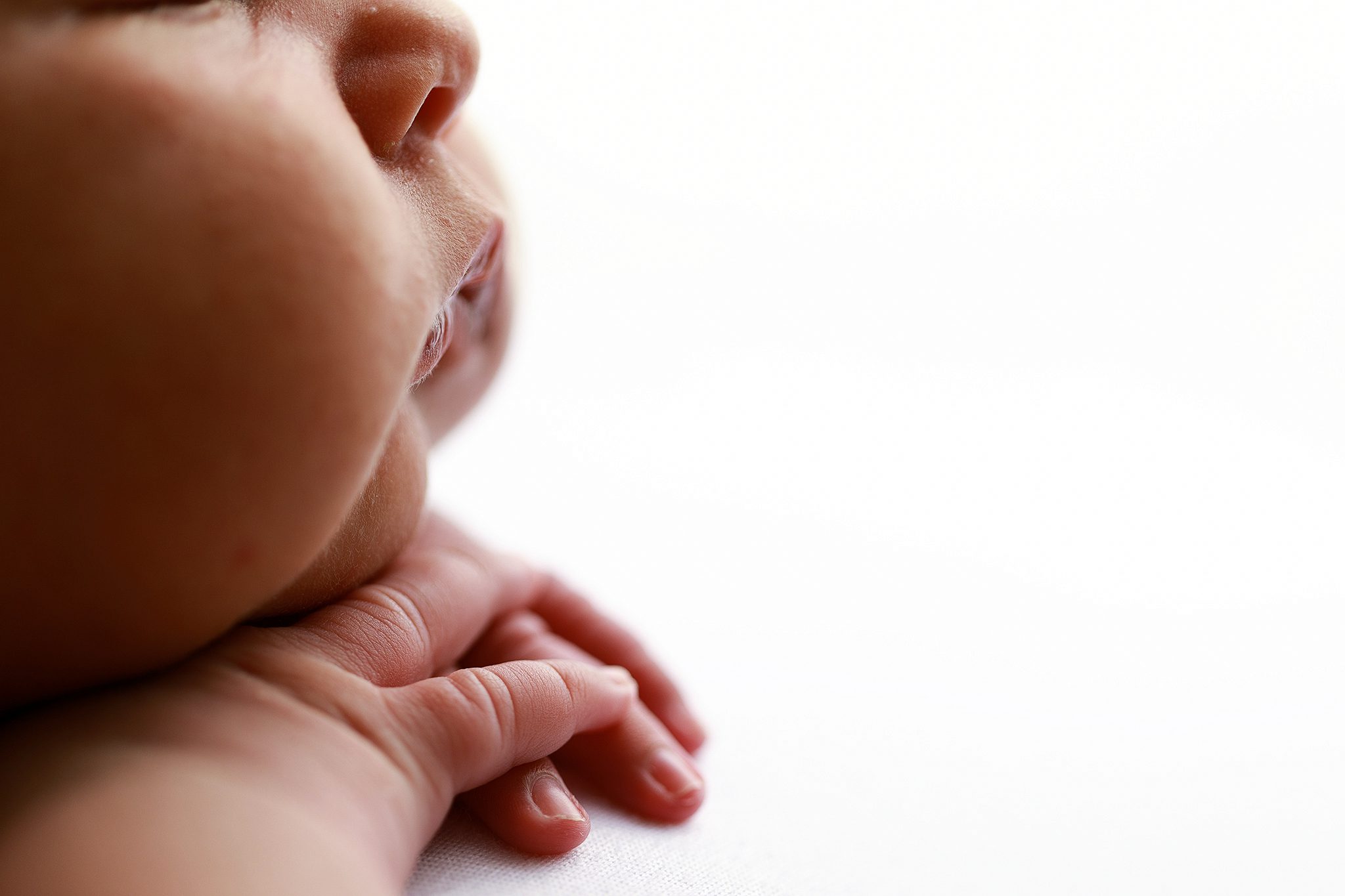 Newborn up close detailed image of hands and lips