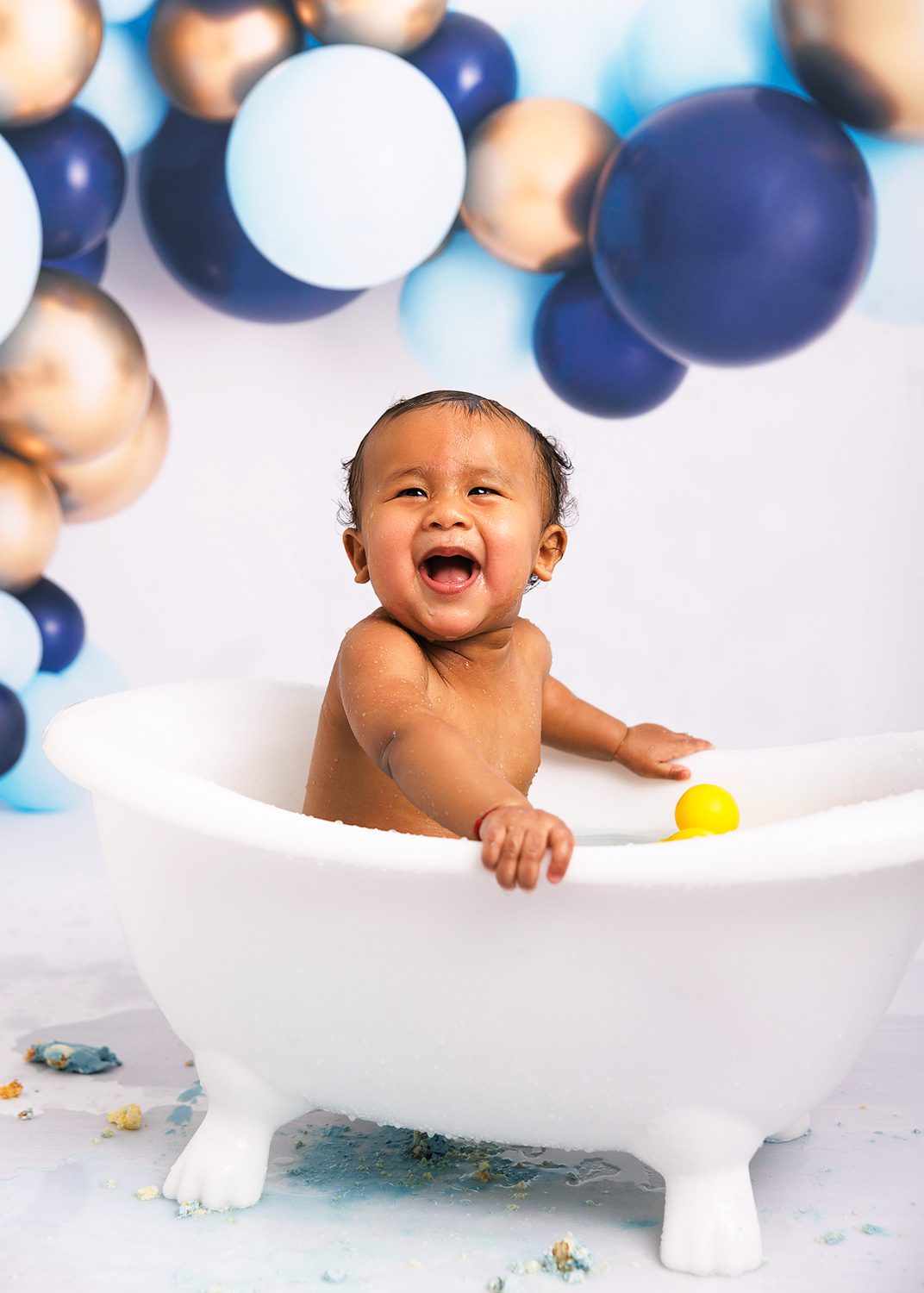 1 year old cake smash session in bubble bath tub in woking