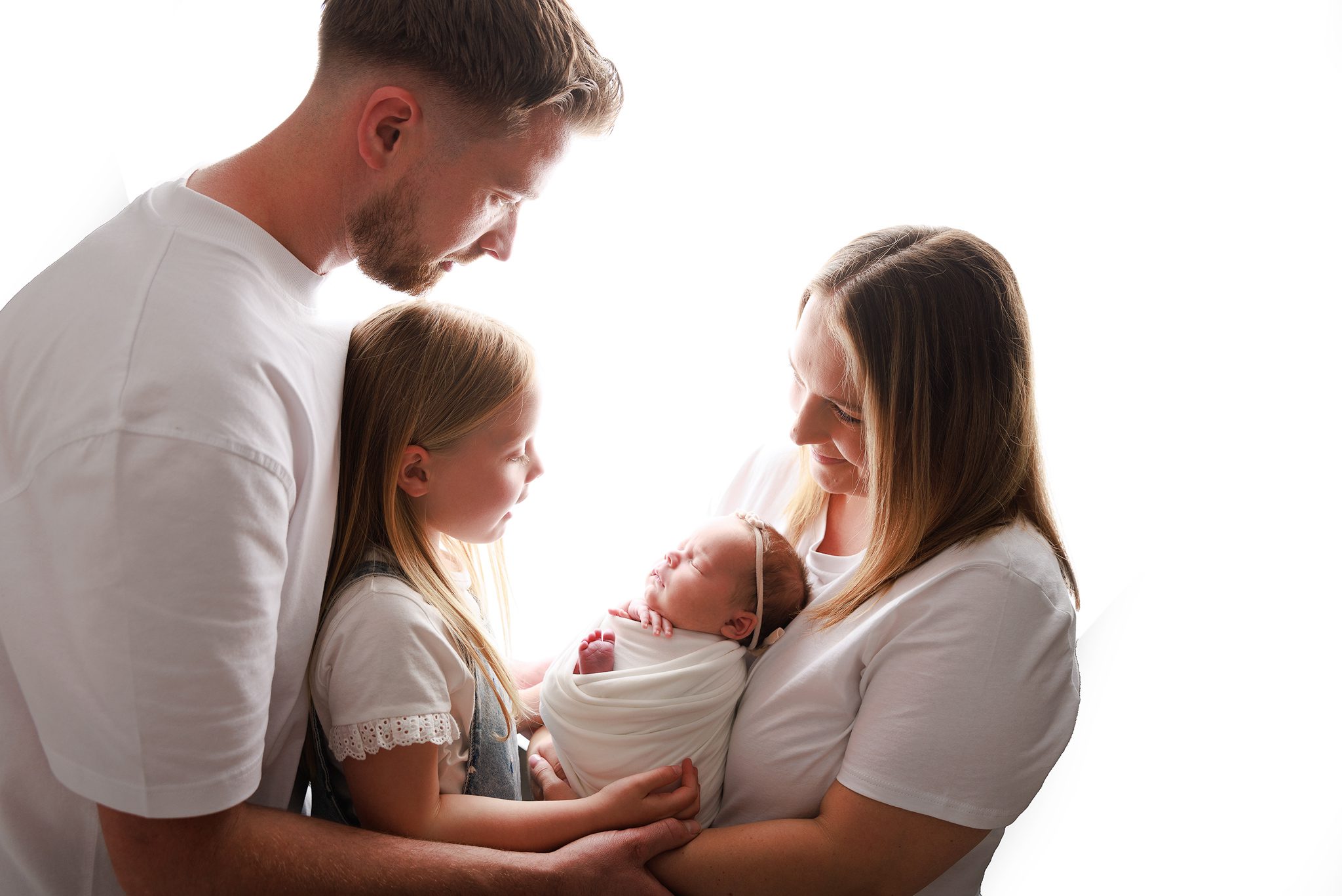 Family of 4 with a newborn and young child in their Woking photoshoot